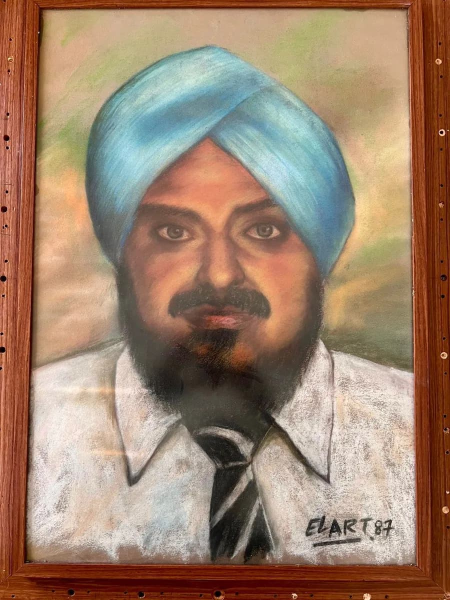 A framed pastel portrait of Mr. Sarjeet Singh (LLN), wearing his turban